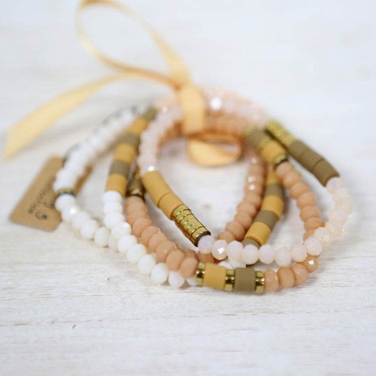 Set of 4 crystal and rubber bracelets in peach tone 2 per pack FJ017B
