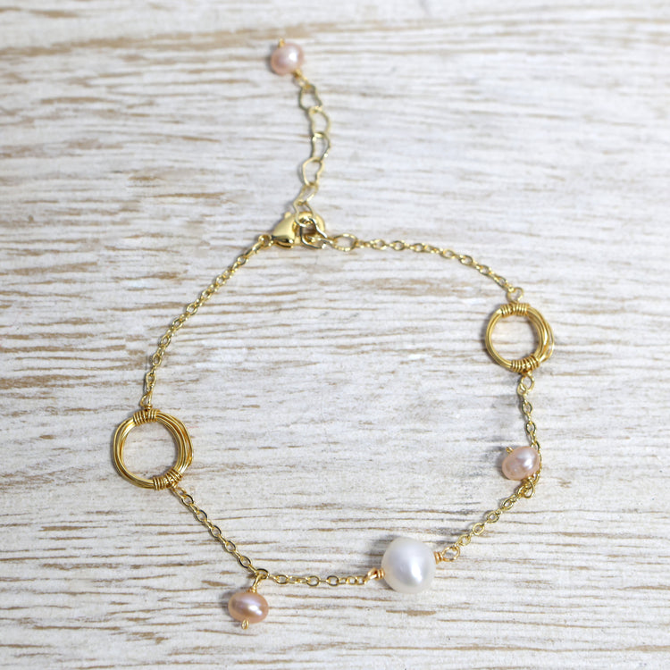 Rhodium plated bracelet with pearl and circle detail 2 per pack TFA61094