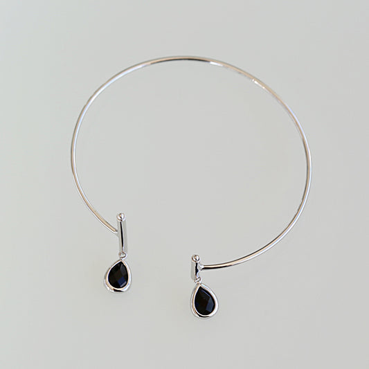 Half moon bangle with 2 black crystal charms